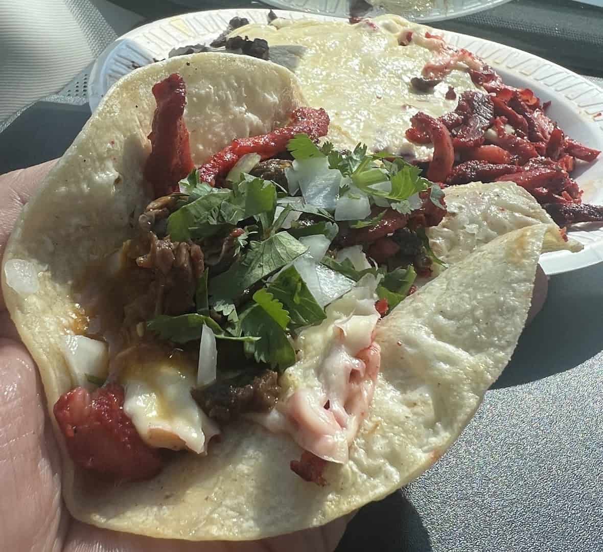Trompo al pastor taco with green salsa at El Taconazo in Houston