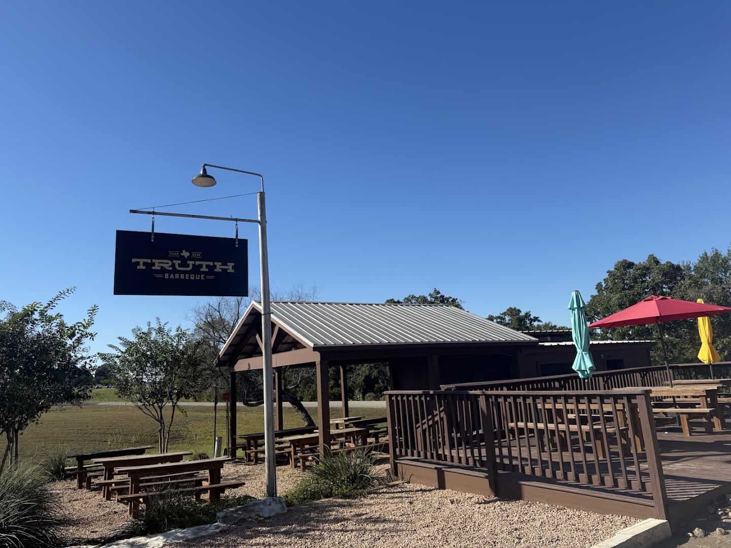Exterior sign and pavilion at Truth Barbeque in Brenham, Texas