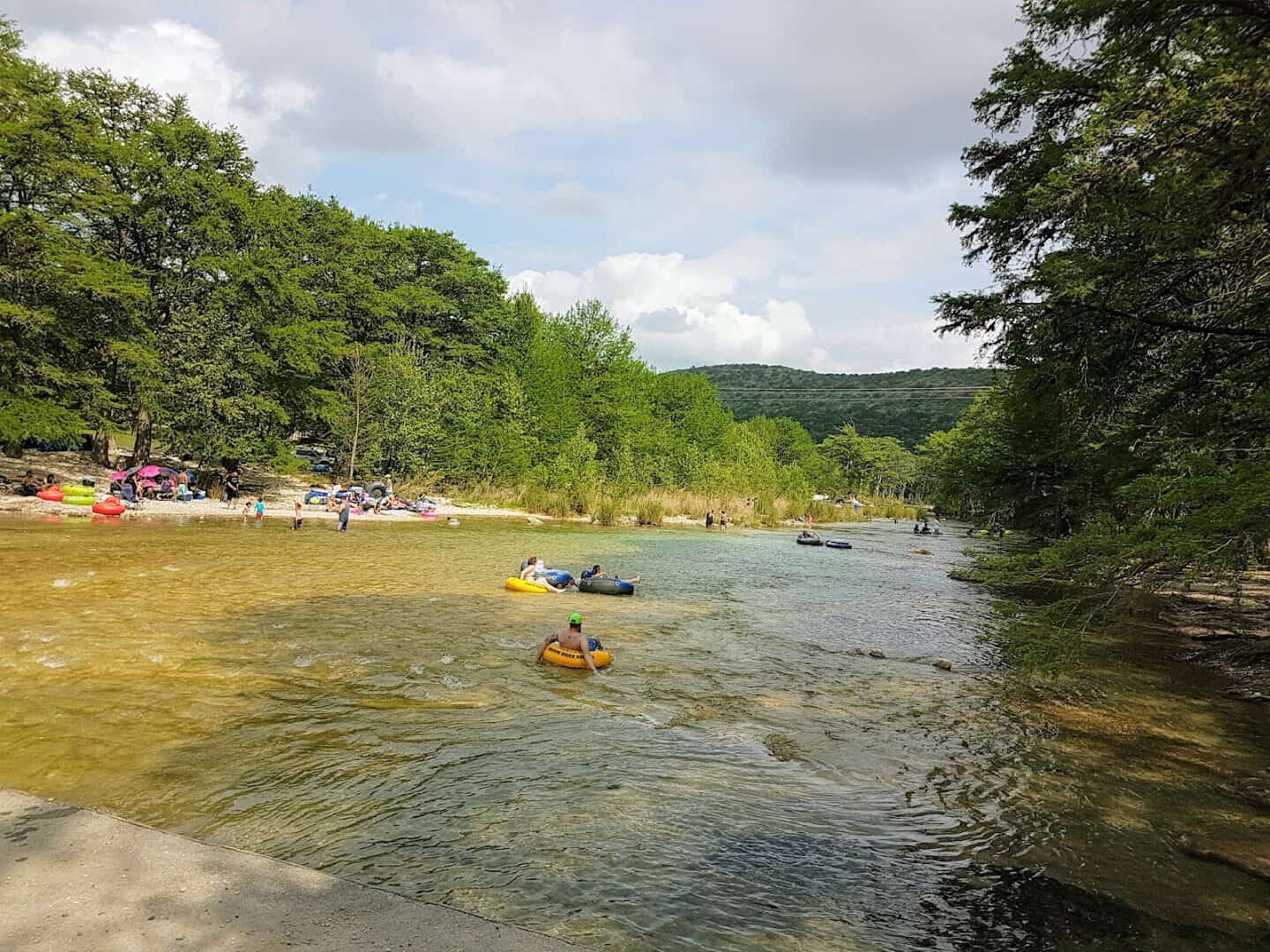 Tubing and floating on the clear Frio River at Concan, Texas