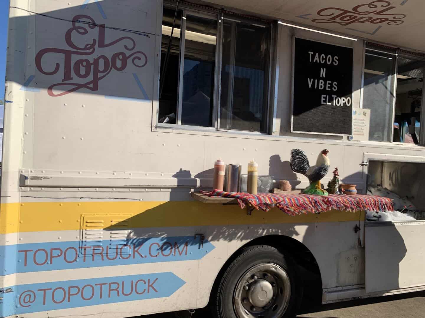 El Topo taco truck serving prepared food at Urban Harvest Farmers Market in Houston