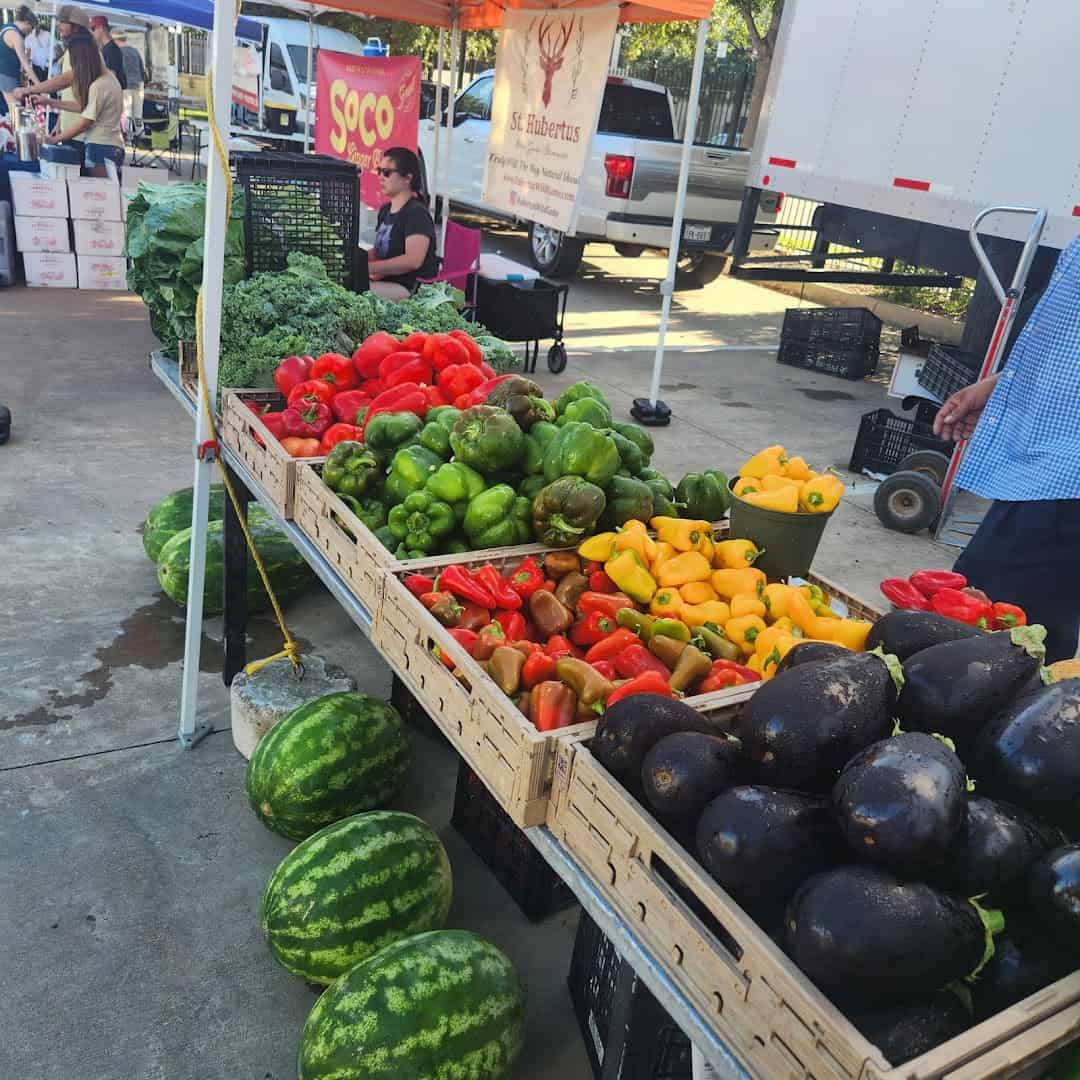 Produce stand with peppers, avocados and watermelons at Urban Harvest Farmers Market