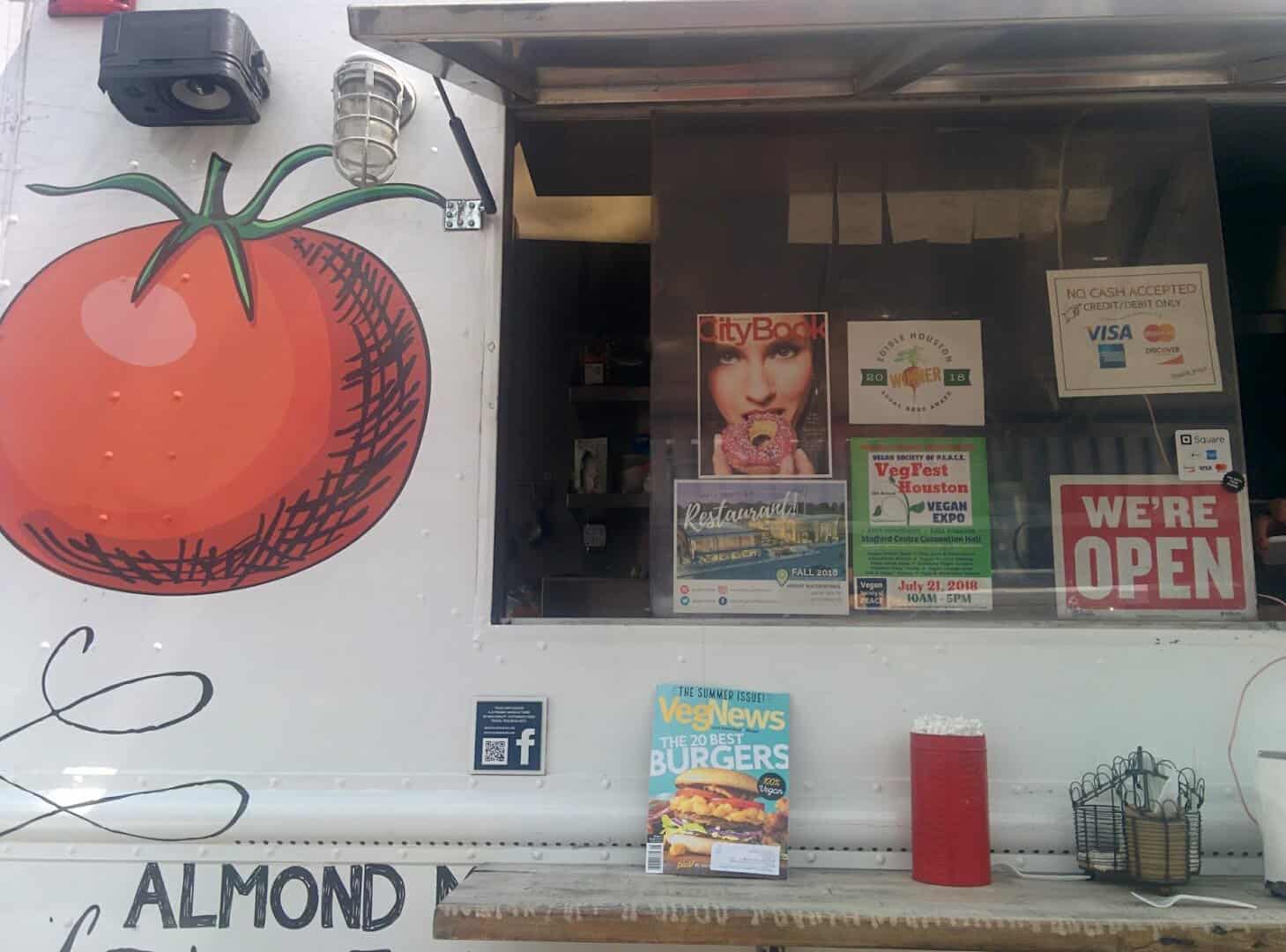 Small-batch packaged goods and signage at a vendor stall at Urban Harvest Farmers Market