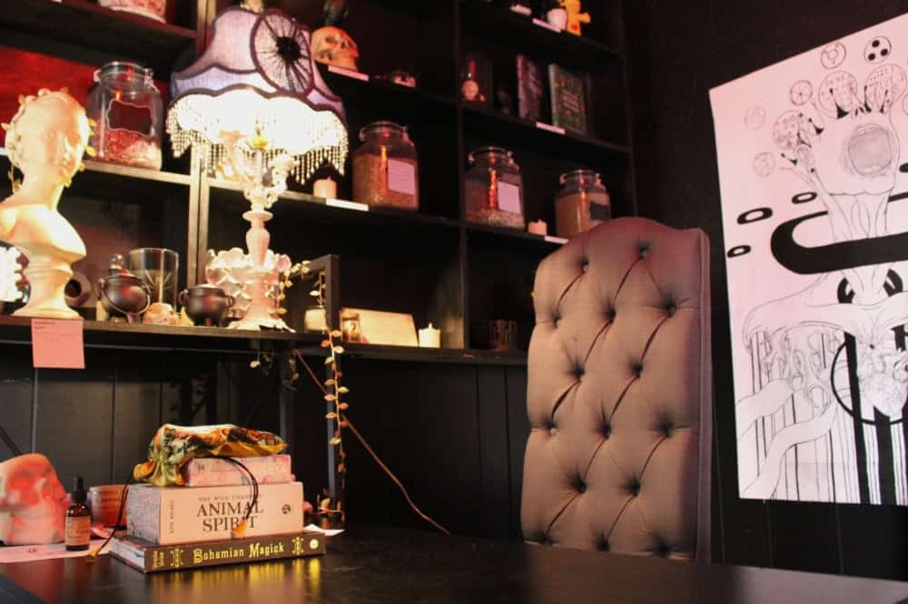 Velvet Victorian seating and a curio bust inside Triple Six Social in San Marcos
