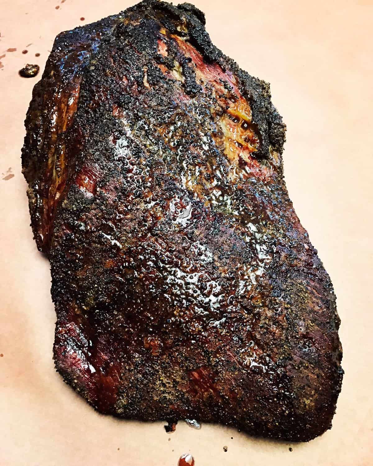 Whole smoked brisket with dark peppery bark at Victorian's Barbecue in Mart, Texas