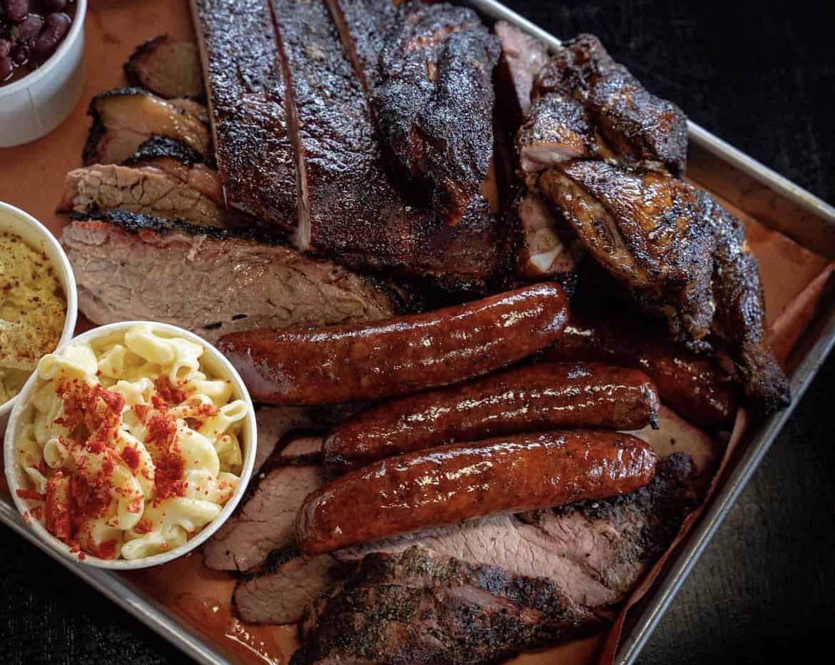 Barbecue tray with brisket, ribs, sausage and mac and cheese at Victorian's Barbecue in Mart, Texas