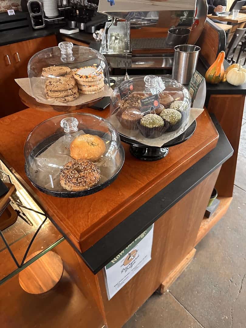 Cafe counter with pastries and espresso machine at Victrola Coffee Roasters in Seattle