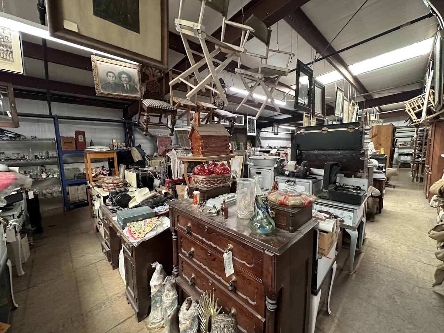 Aisles of vintage furniture and antiques filling The Whoopee Bowl Antique Mall in Canutillo, Texas