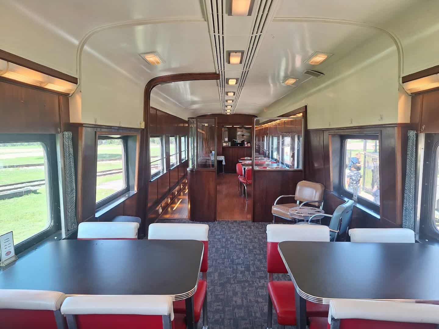 Warm vintage interior of a restored passenger car on the Hill Country Flyer
