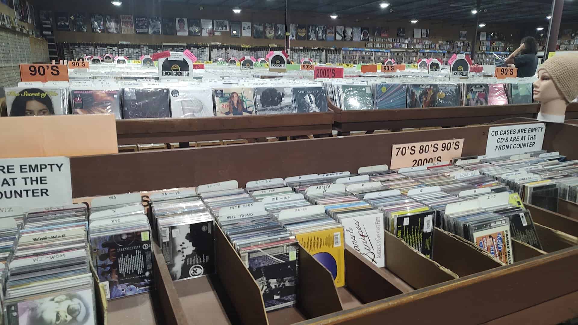Vinyl bins and browsing tables at Forever Young Records in Grand Prairie, Texas