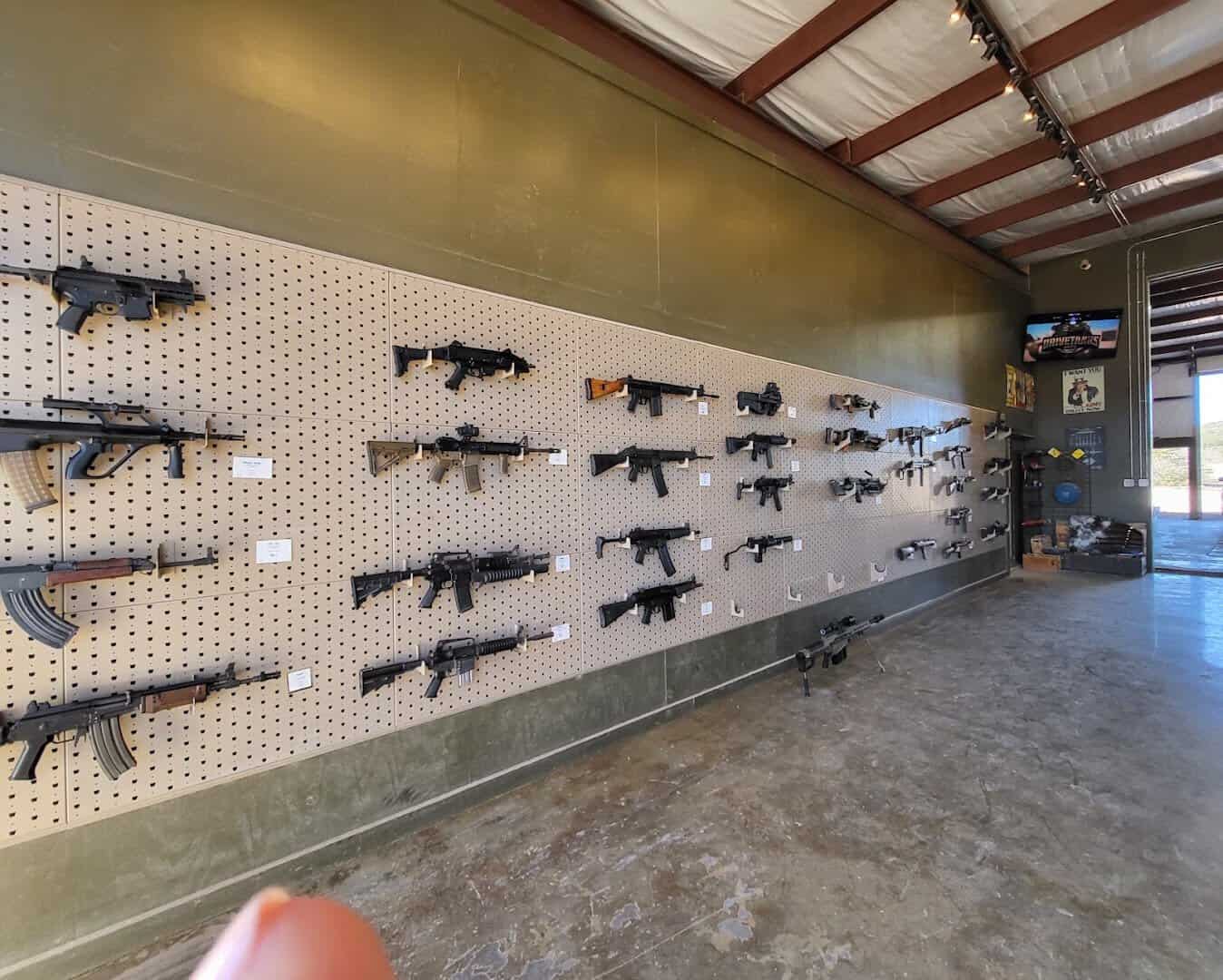 Wall of rifles and machine guns to shoot at DriveTanks near Uvalde, Texas