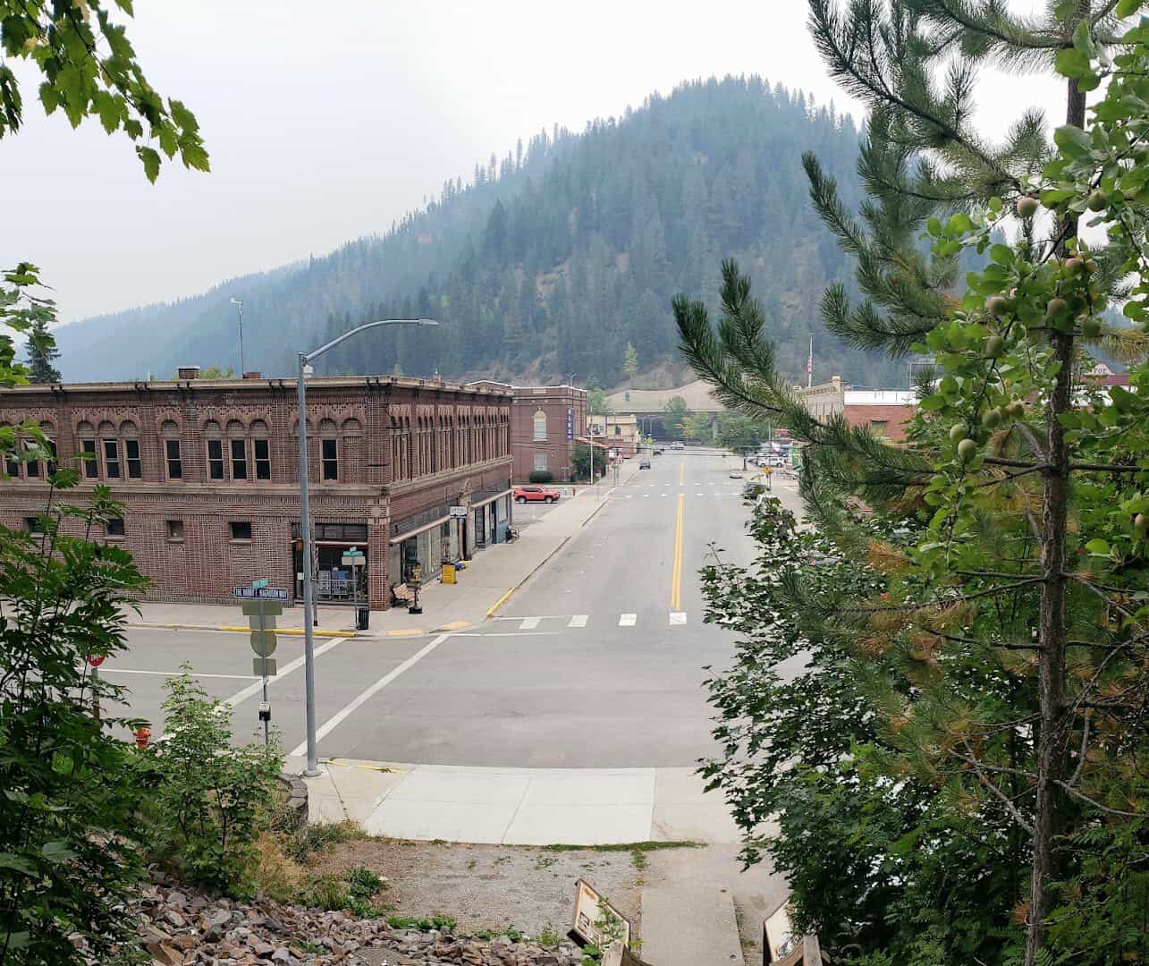 Historic downtown Wallace framed by forested mountains in Wallace, Idaho