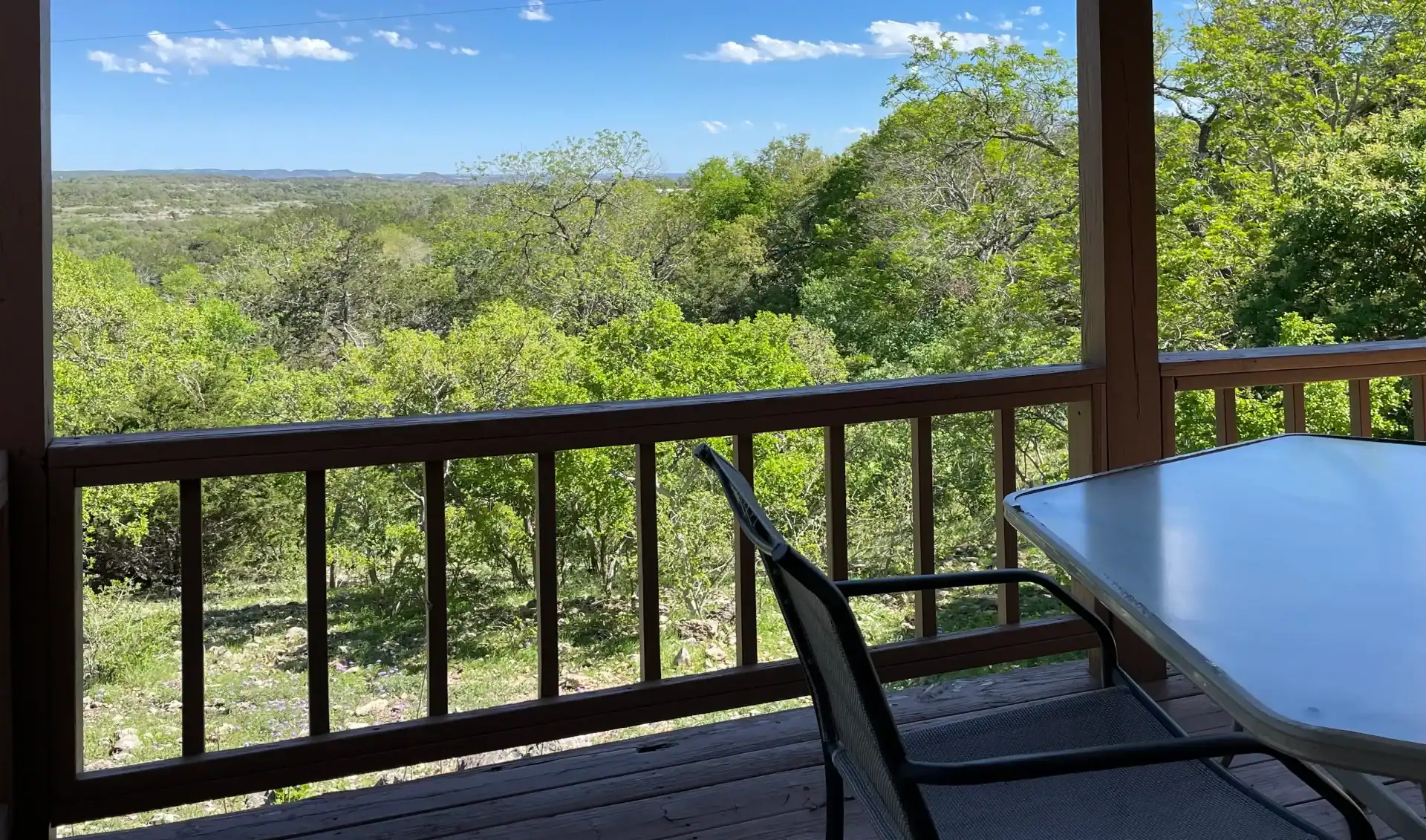 Cabin porch overlooking the canyon at Walnut Canyon Cabins near Fredericksburg, Texas