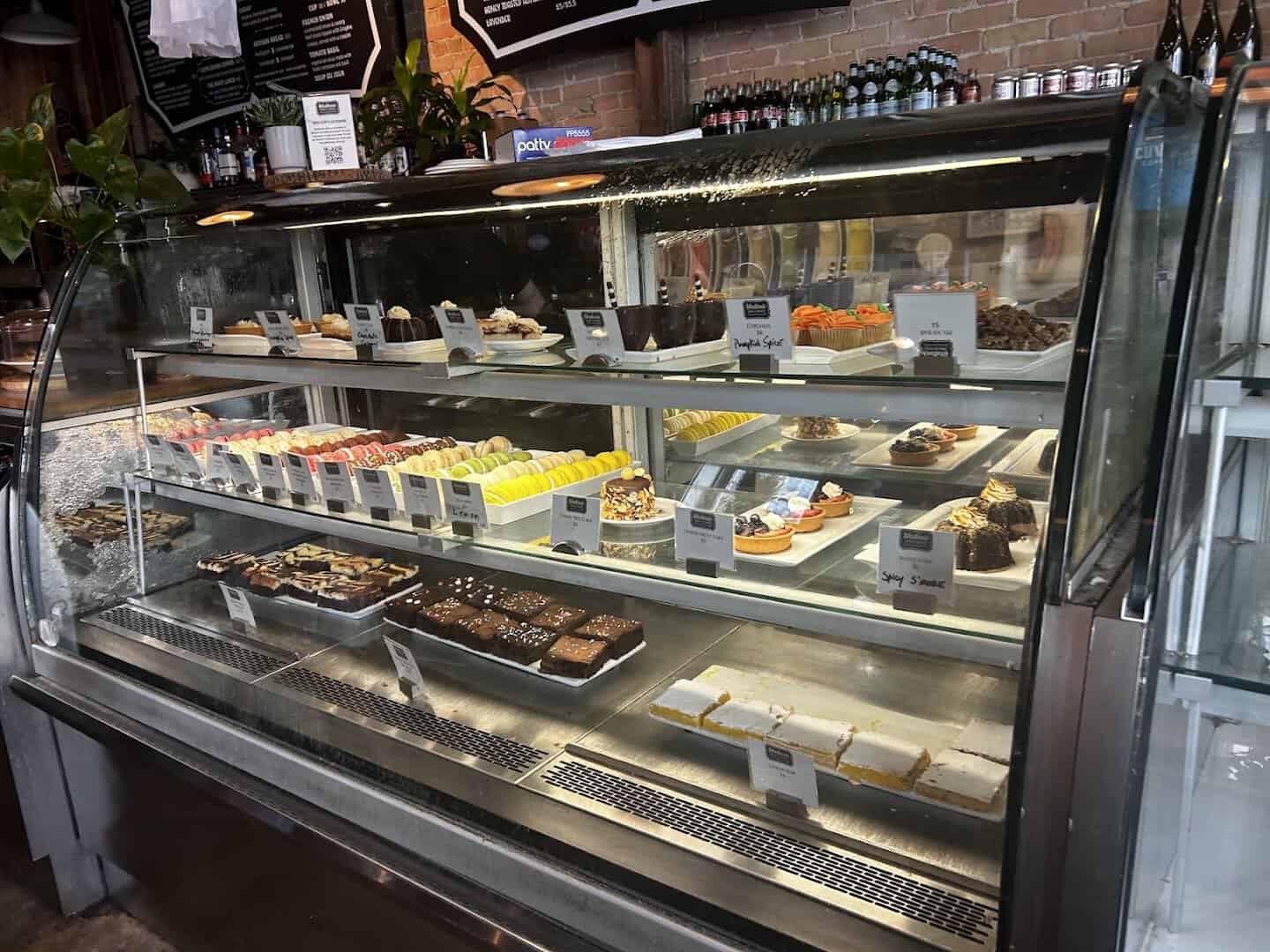 Bakery case full of pastries and cakes at Walton's Fancy and Staple in Austin