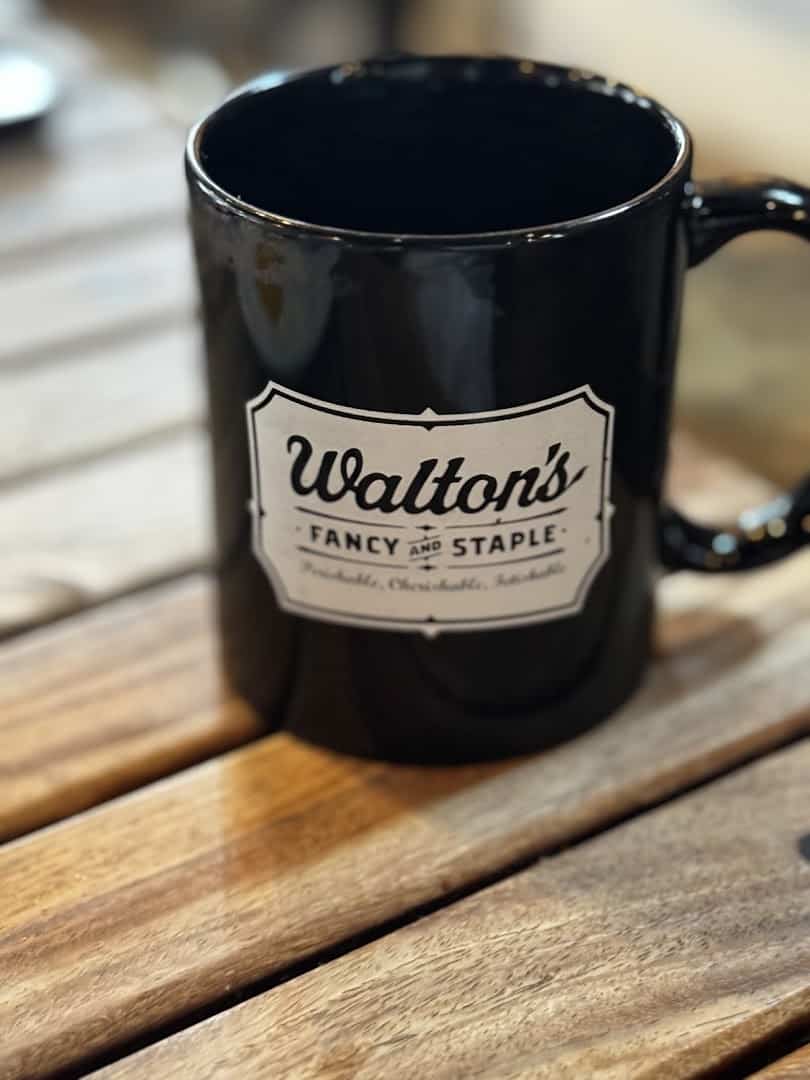 Black Walton's Fancy and Staple branded coffee mug in Austin