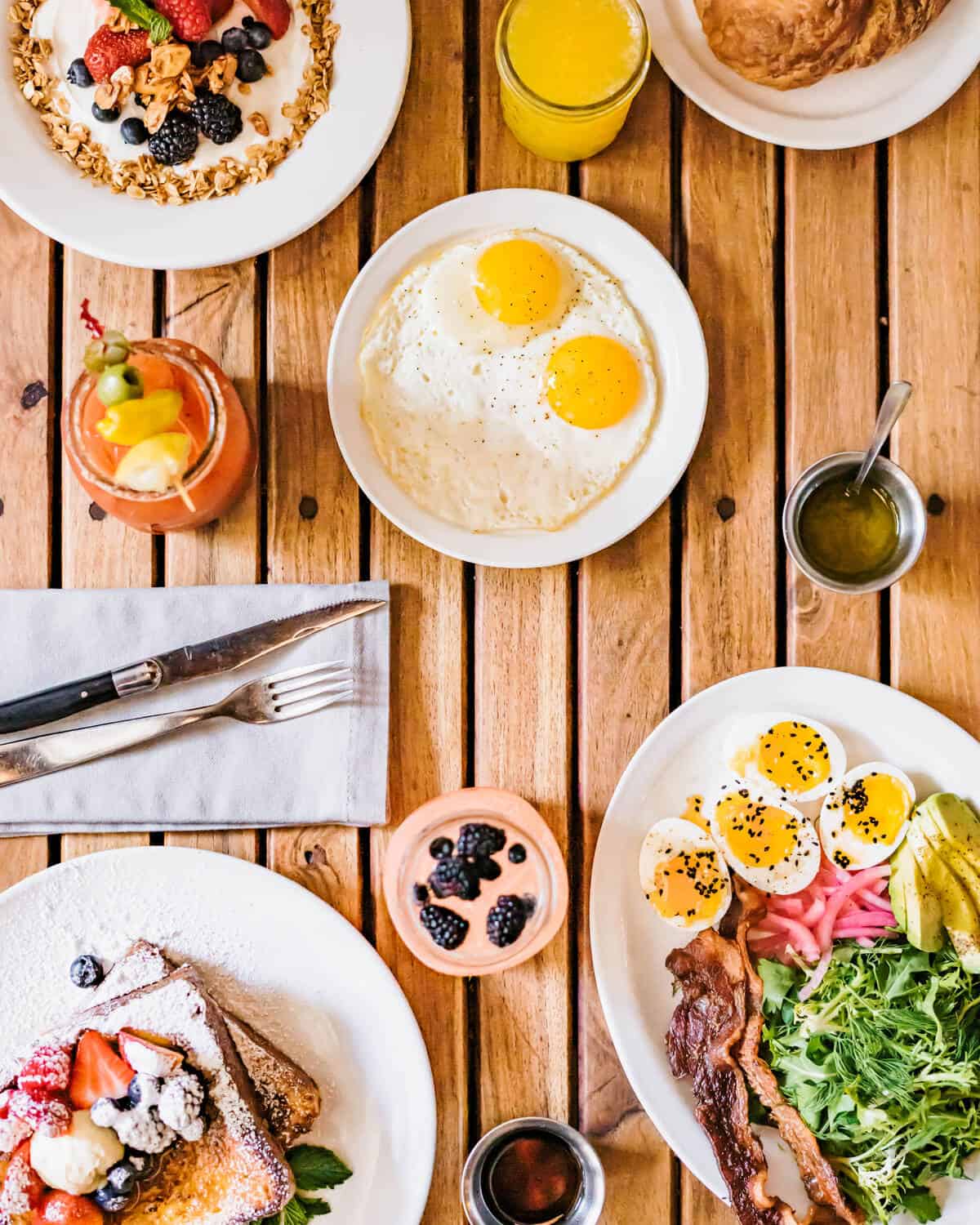 Breakfast spread of eggs, pastries and fruit at Walton's Fancy and Staple in Austin
