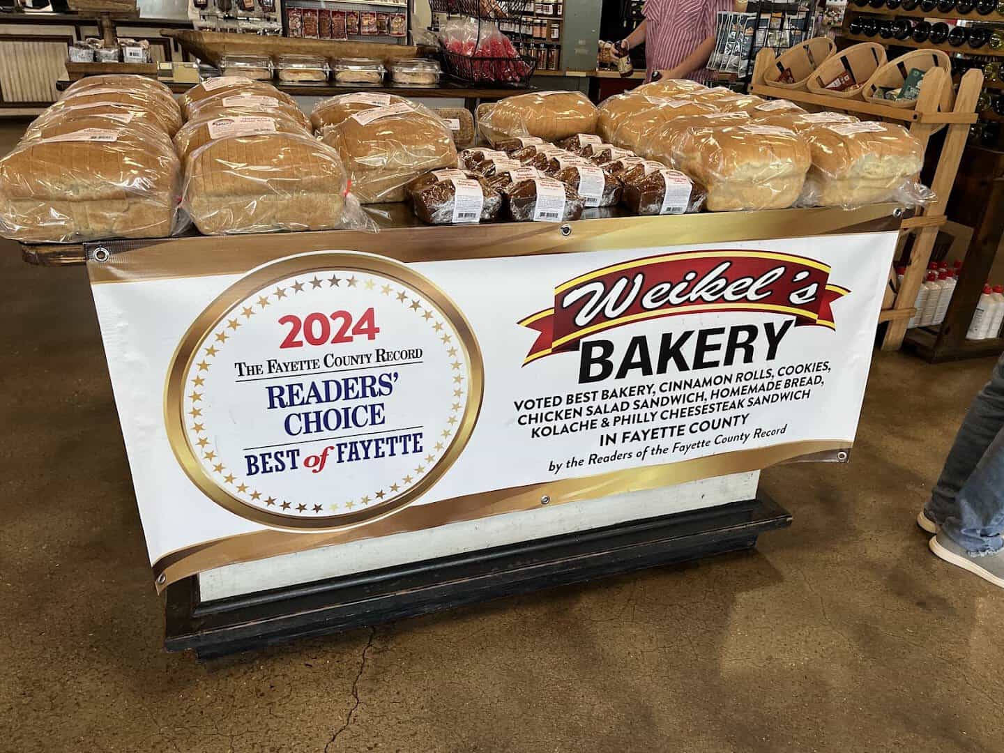 Weikel's Bakery breads beside its Best of Fayette award banner in La Grange, Texas