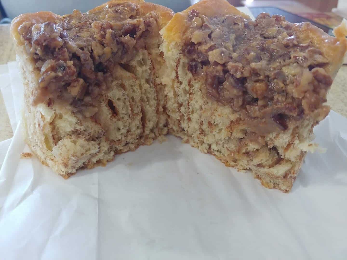 Pecan cinnamon roll cut open at Weikel's Bakery in La Grange, Texas