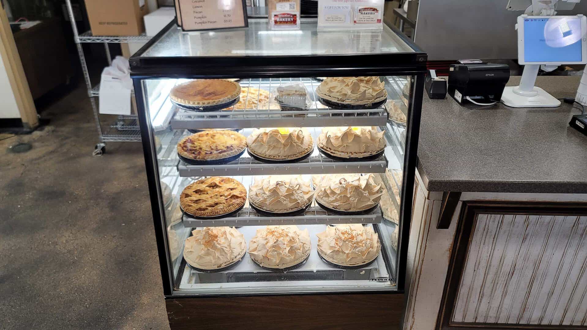 Case of fruit and meringue pies with price list at Weikel's Bakery in La Grange, Texas