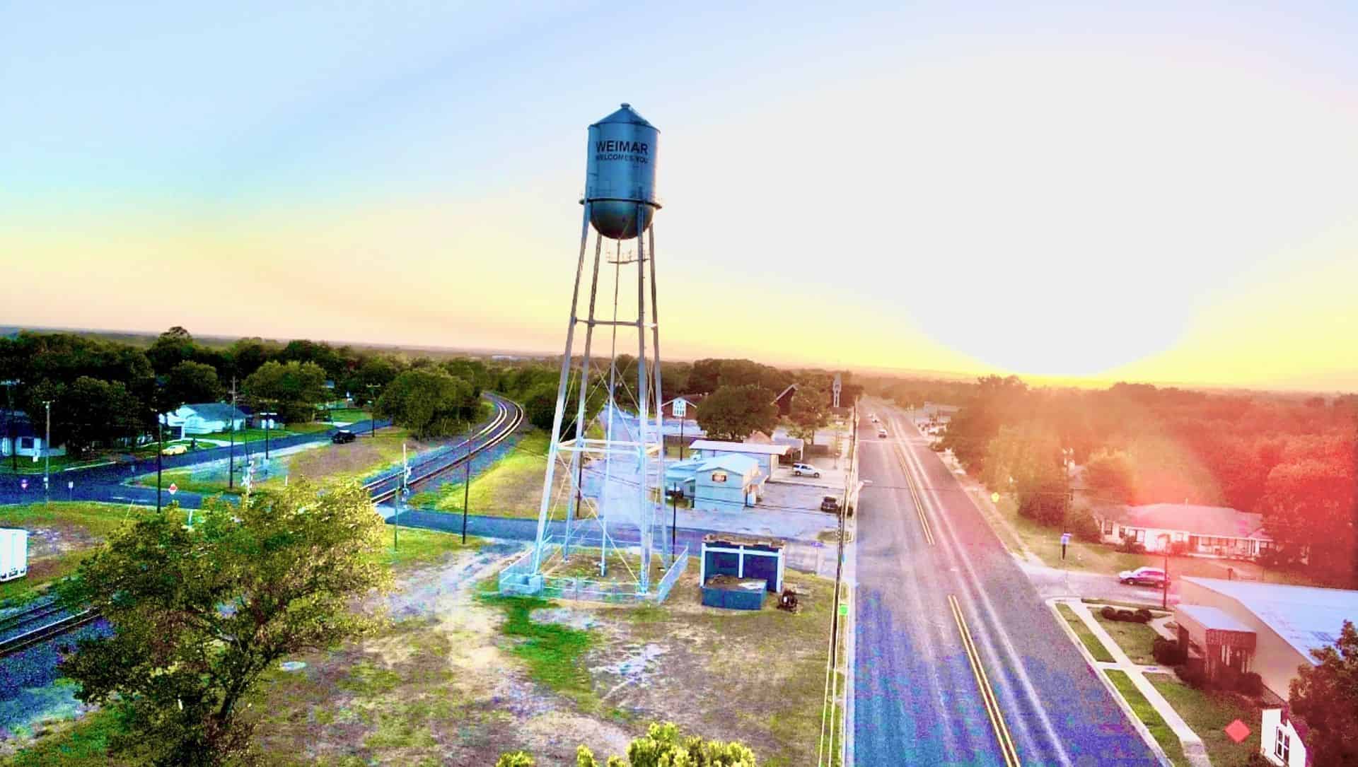 Weimar, Texas water tower over town at sunset