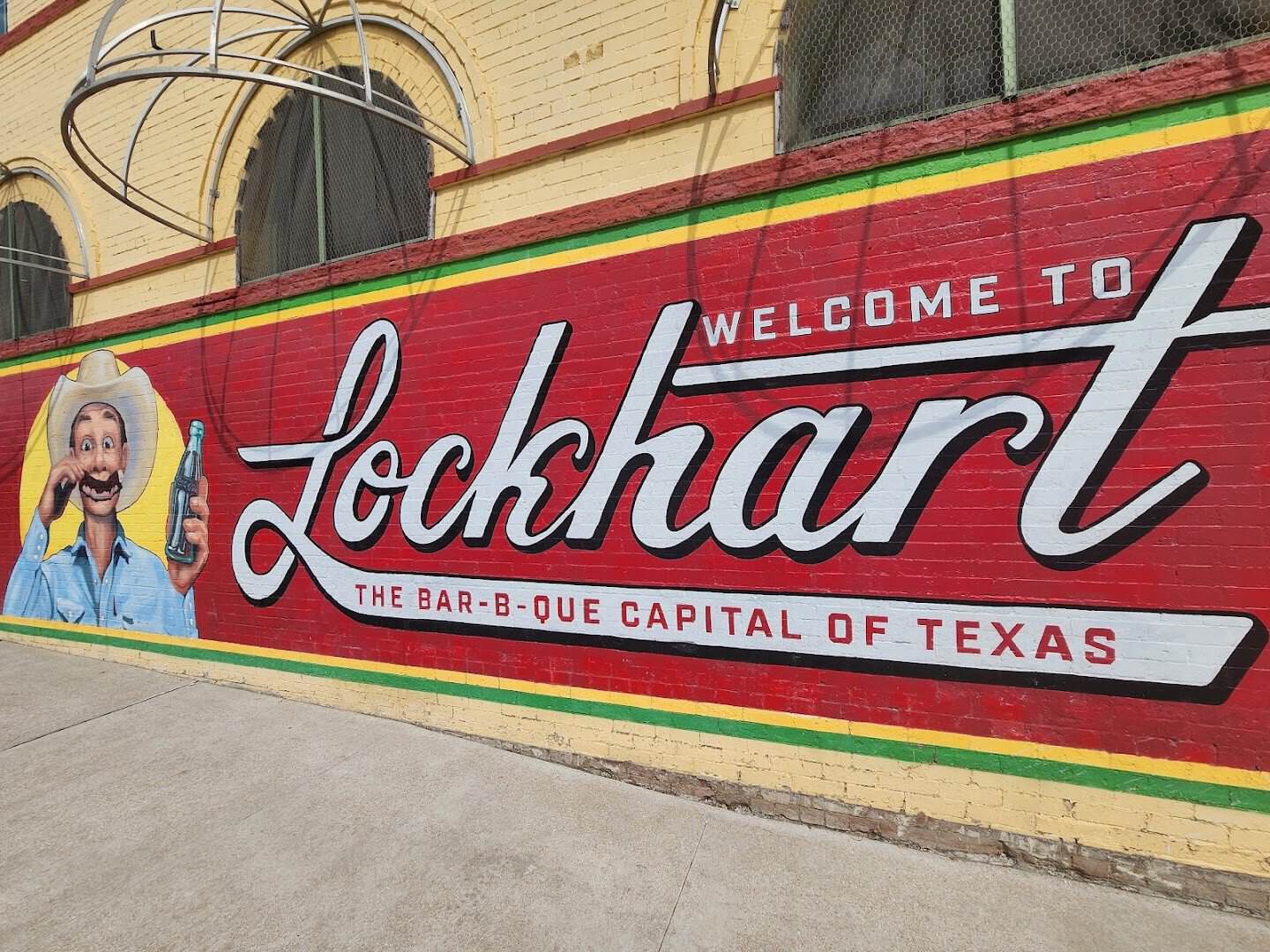 Welcome to Lockhart Barbecue Capital of Texas mural in Lockhart, Texas