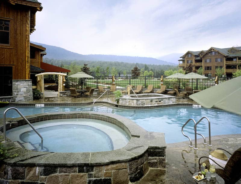 Outdoor hot tub with mountain view at The Whiteface Lodge in Lake Placid, New York