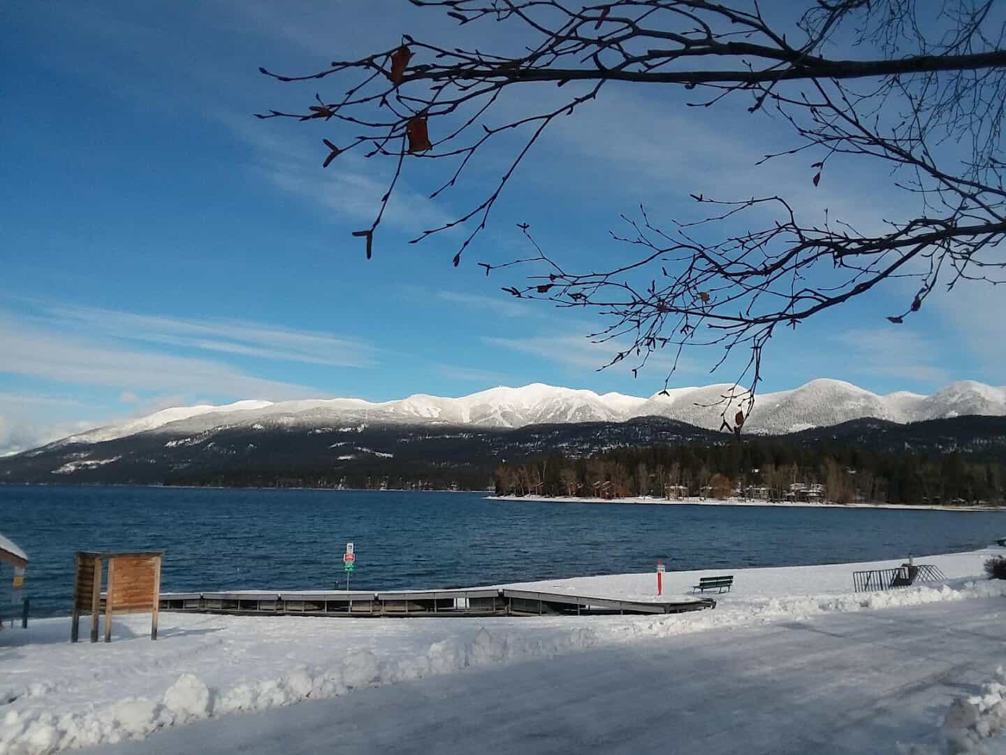 Whitefish Lake below snowy mountains in Whitefish, Montana