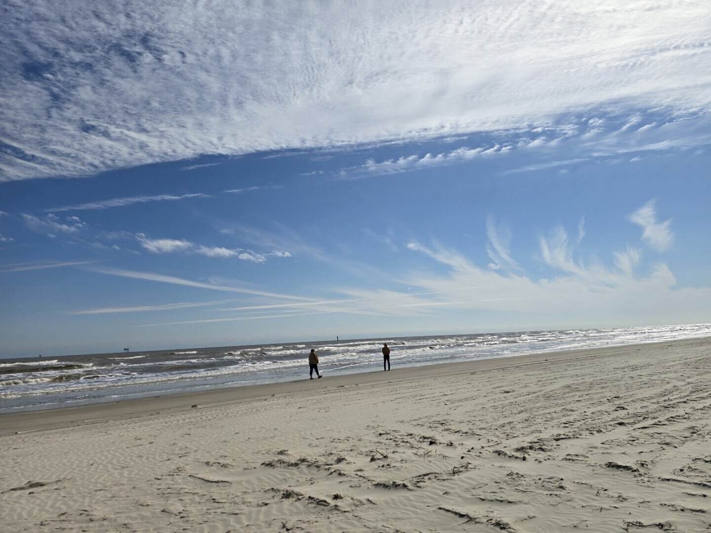 Wide empty Gulf beach under a dramatic sky at Mustang Island State Park, Texas