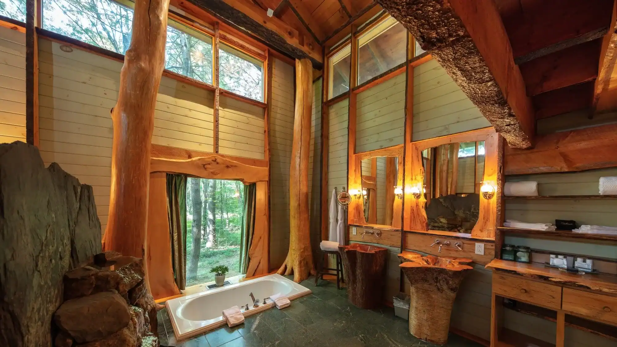 Luxury treehouse interior with forest windows at Winvian Farm in Morris, Connecticut