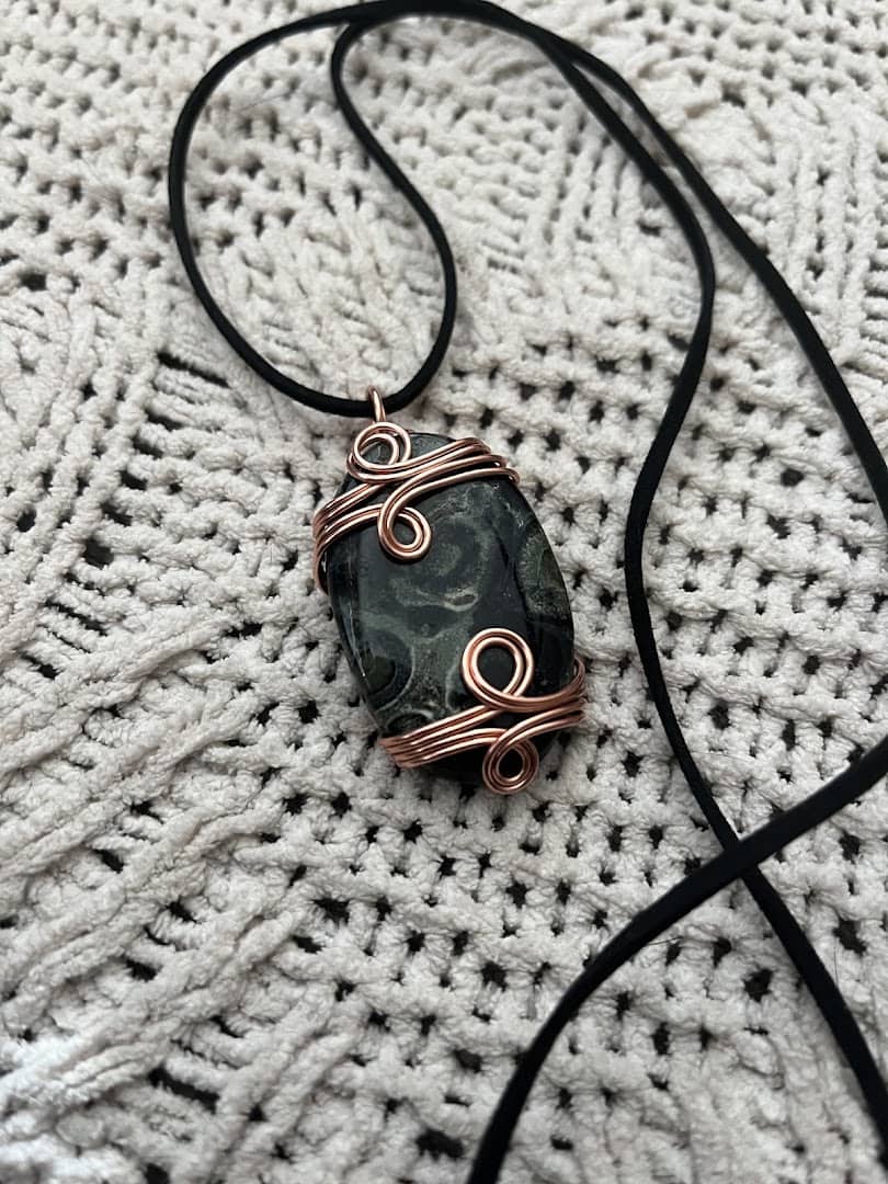 A wire-wrapped crystal pendant necklace from Shiny Things For Shiny People in Austin