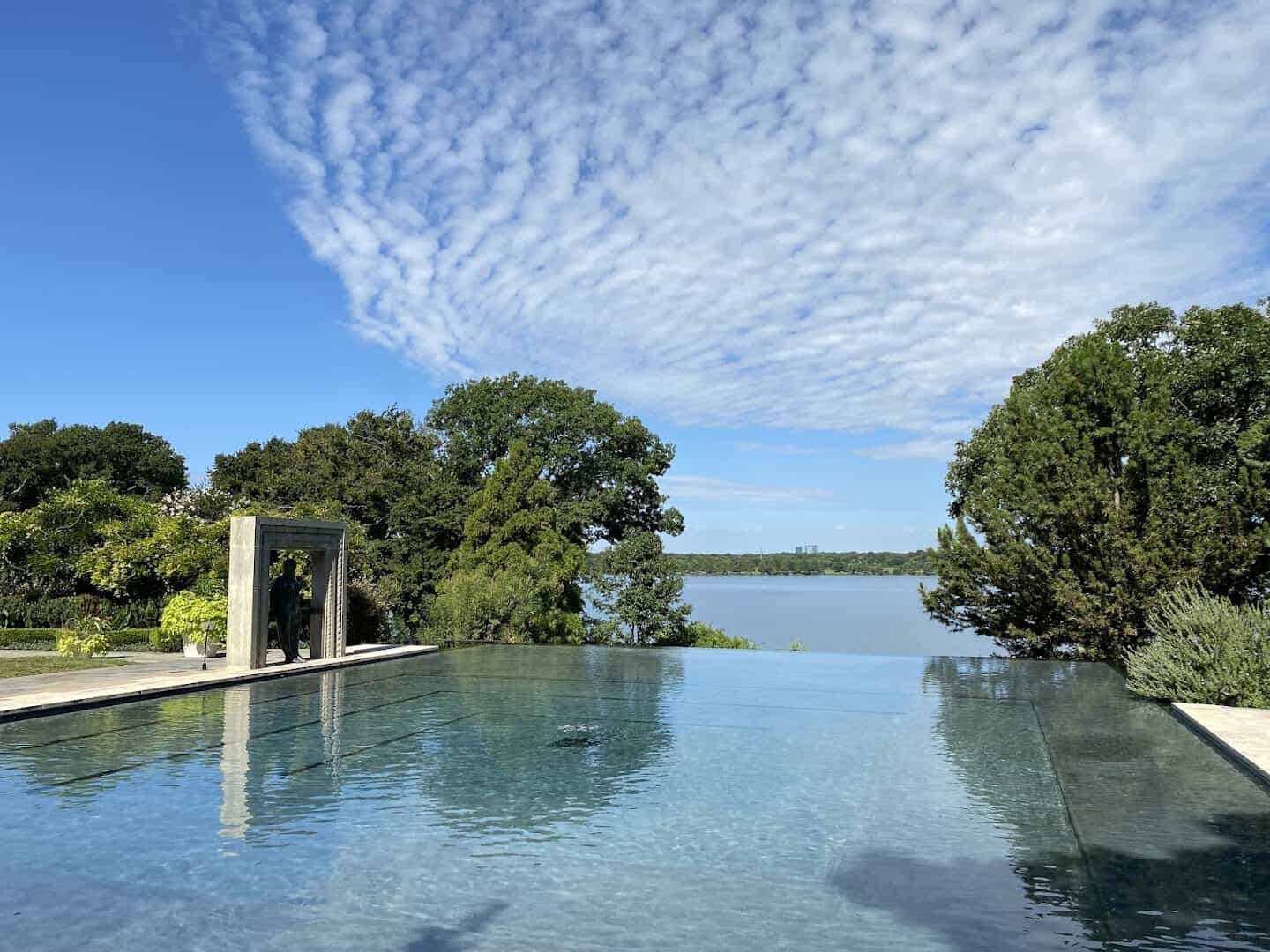 The infinity pool and sculpture in A Woman's Garden at the Dallas Arboretum in Dallas