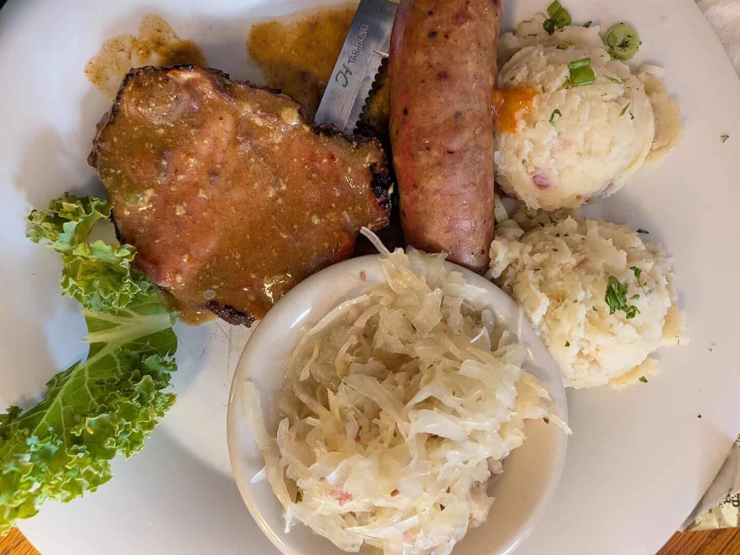 Schnitzel with sausage, sauerkraut and potato dumplings at Der Lindenbaum in Fredericksburg