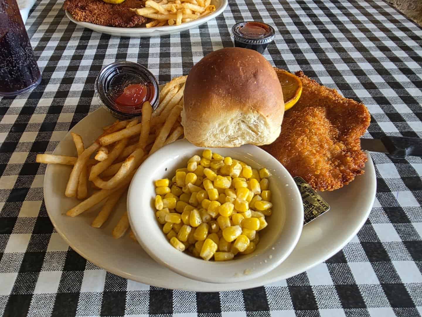 Breaded schnitzel sandwich with fries at The Auslander in Fredericksburg