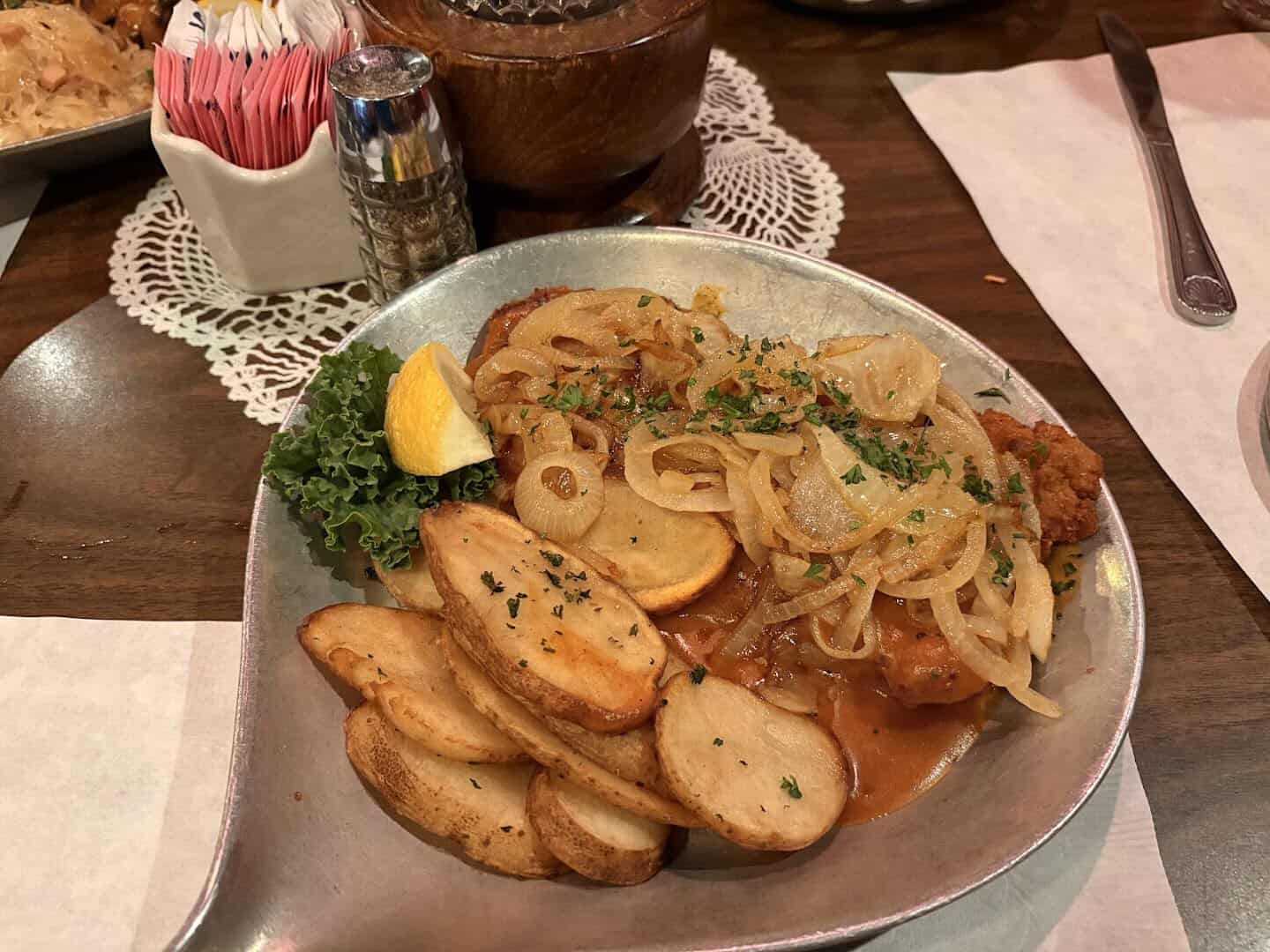 Golden schnitzel with fried potatoes at Friedhelm's Bavarian Inn in Fredericksburg