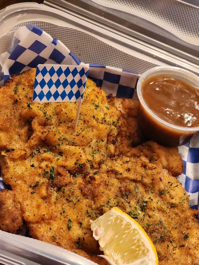 Golden fried schnitzel with gravy at Tiny Schnitzel Haus in Pipe Creek