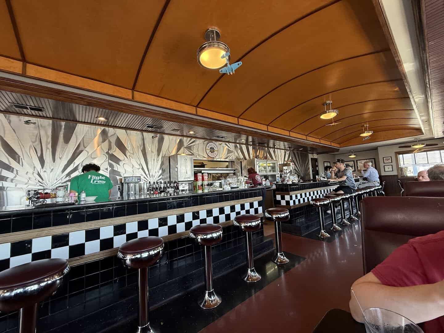 Booths and the curved ceiling inside the 1940s-style Airport Diner in Fredericksburg, Texas