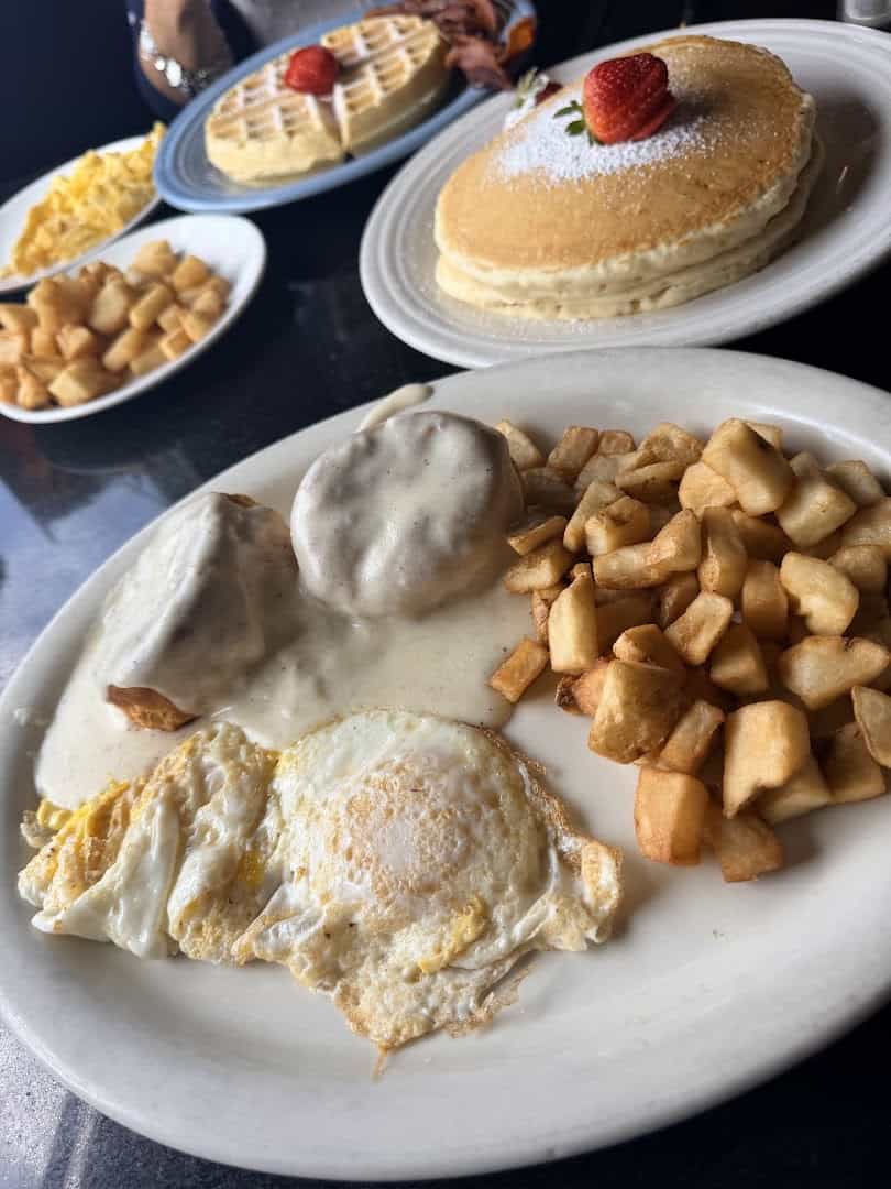 A breakfast spread of biscuits and gravy, eggs, pancakes and potatoes at the Airport Diner in Fredericksburg, Texas