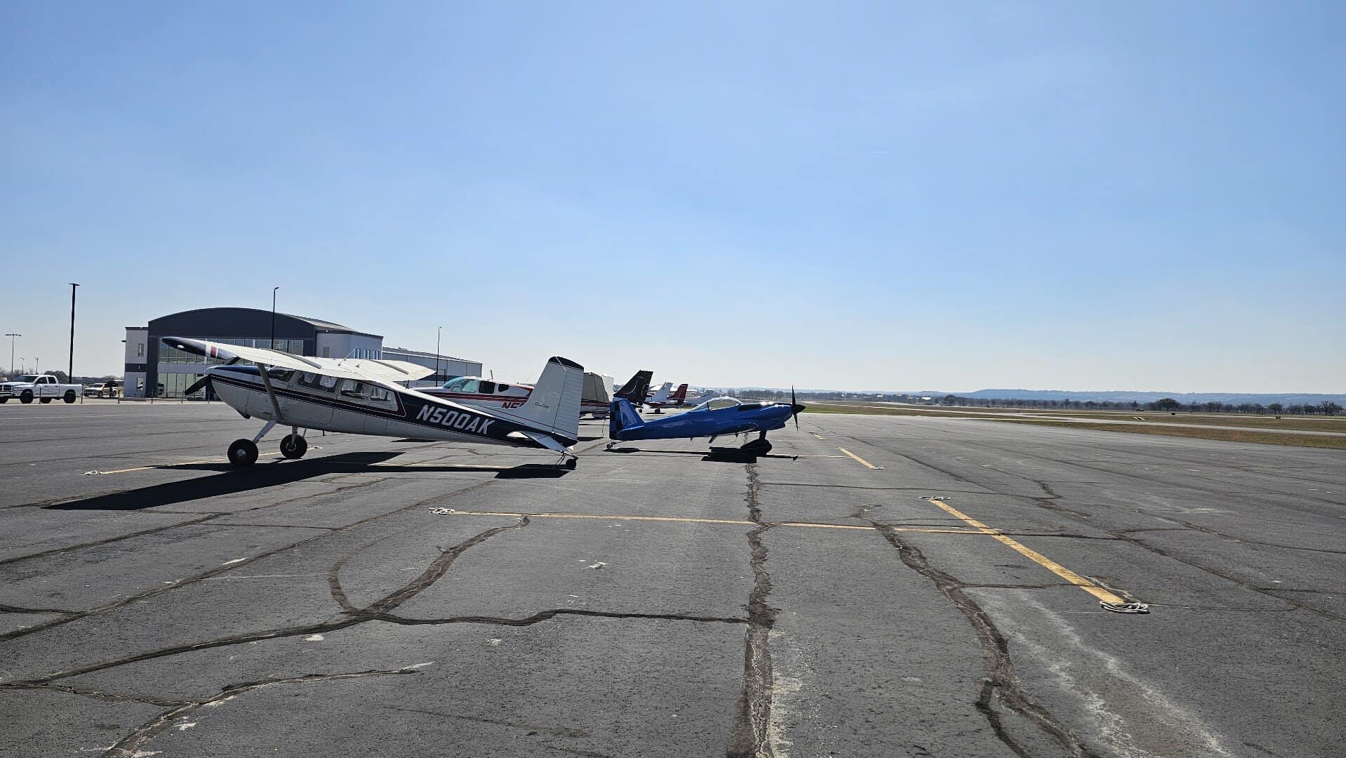 A small plane on the airfield ramp outside the Airport Diner in Fredericksburg, Texas