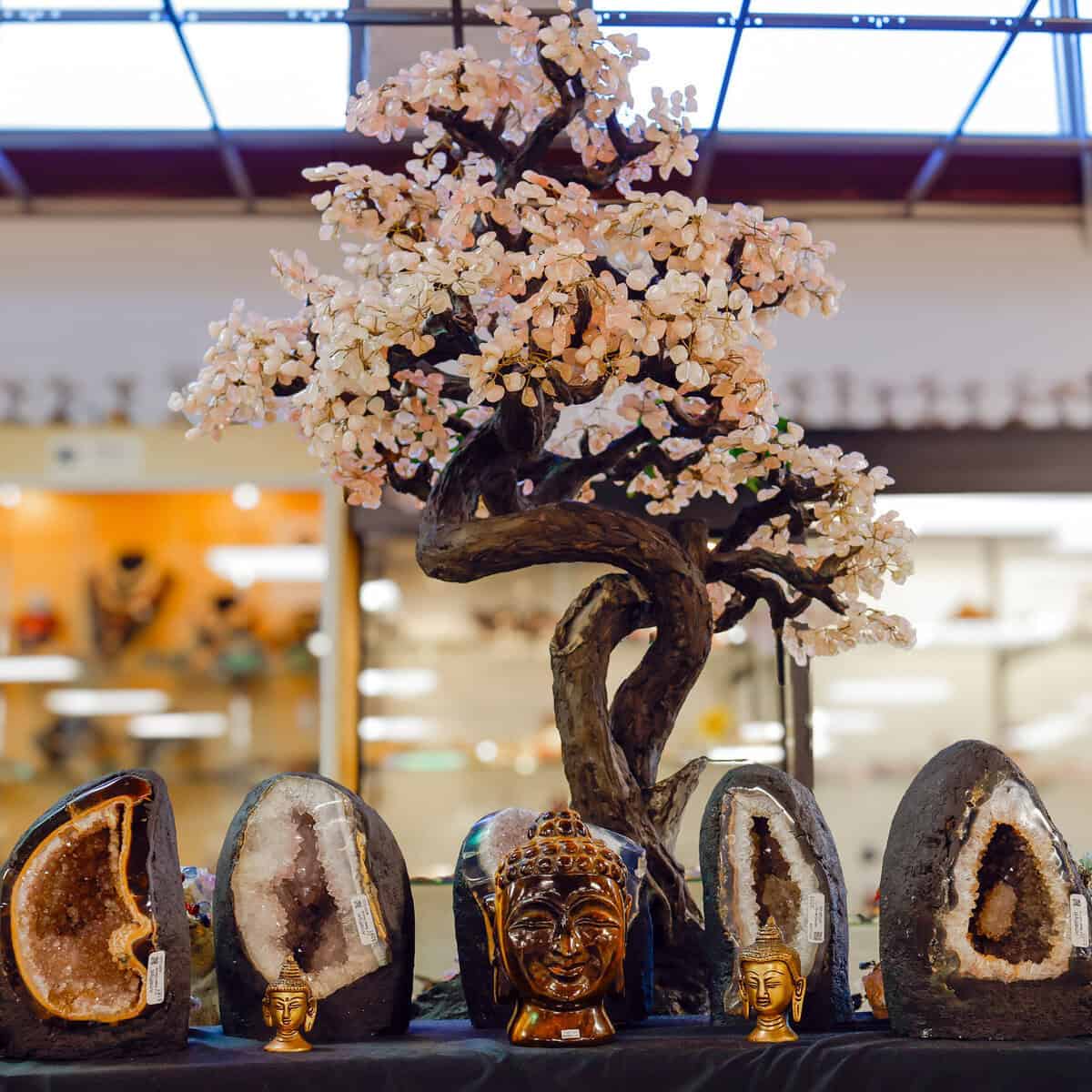 Amethyst geodes and a crystal gem tree on display at Nature's Treasures in Austin