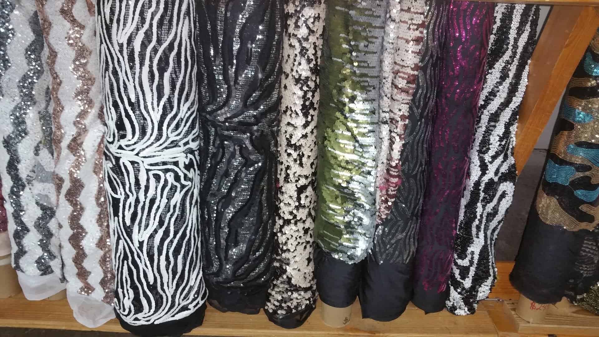 Bolts of animal print apparel fabric standing in a row at Wherehouse Fabrics in Dallas
