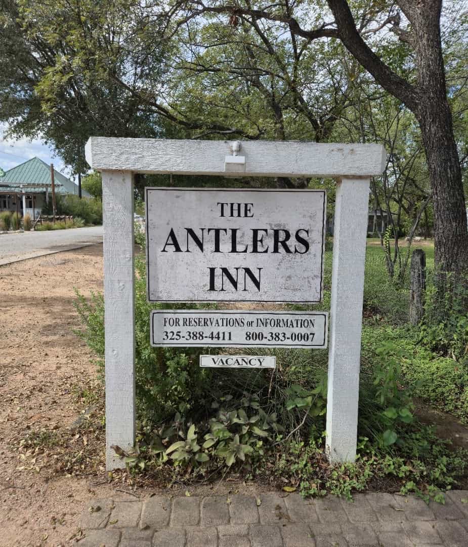 The Antlers Inn entrance sign in Kingsland Texas
