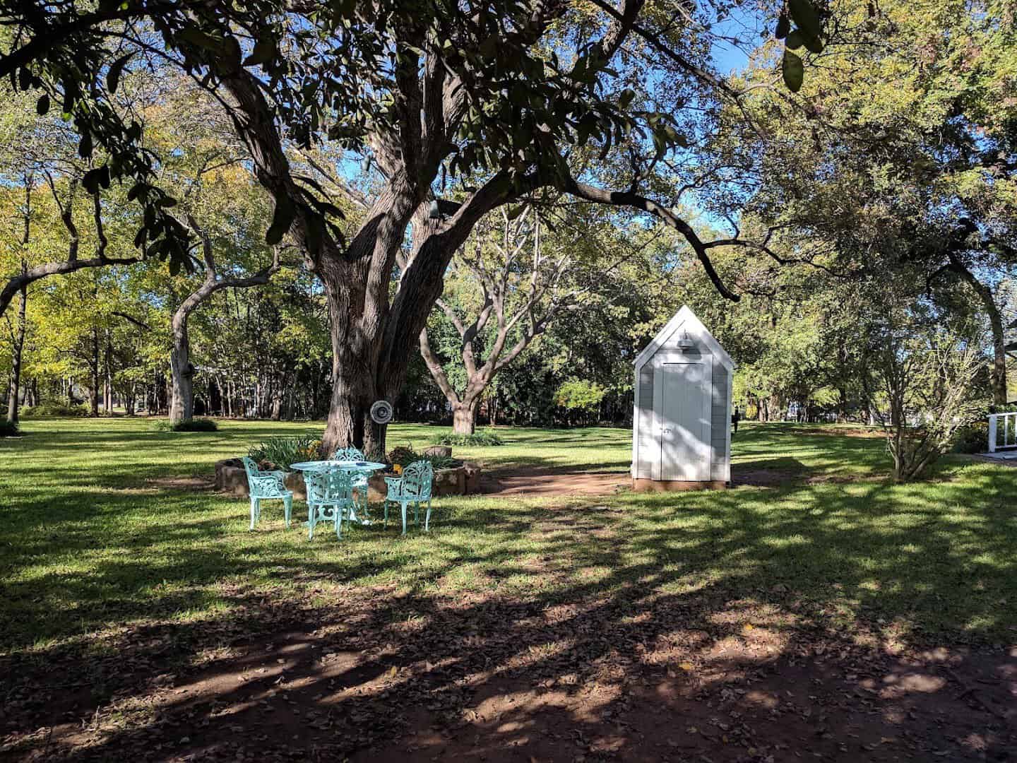 Live oak shaded grounds and picnic area at The Antlers Inn