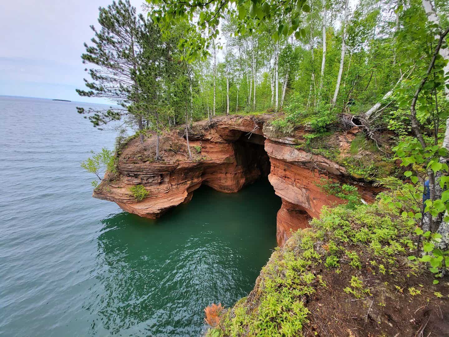 Red sandstone sea cave and arch above Lake Superior at Apostle Islands National Lakeshore, Wisconsin