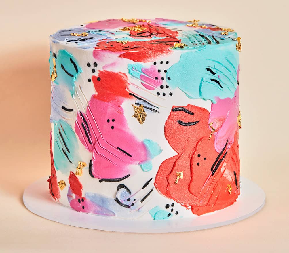 Colorful hand-painted gluten-free cake at Sweet Gilly's in Frisco