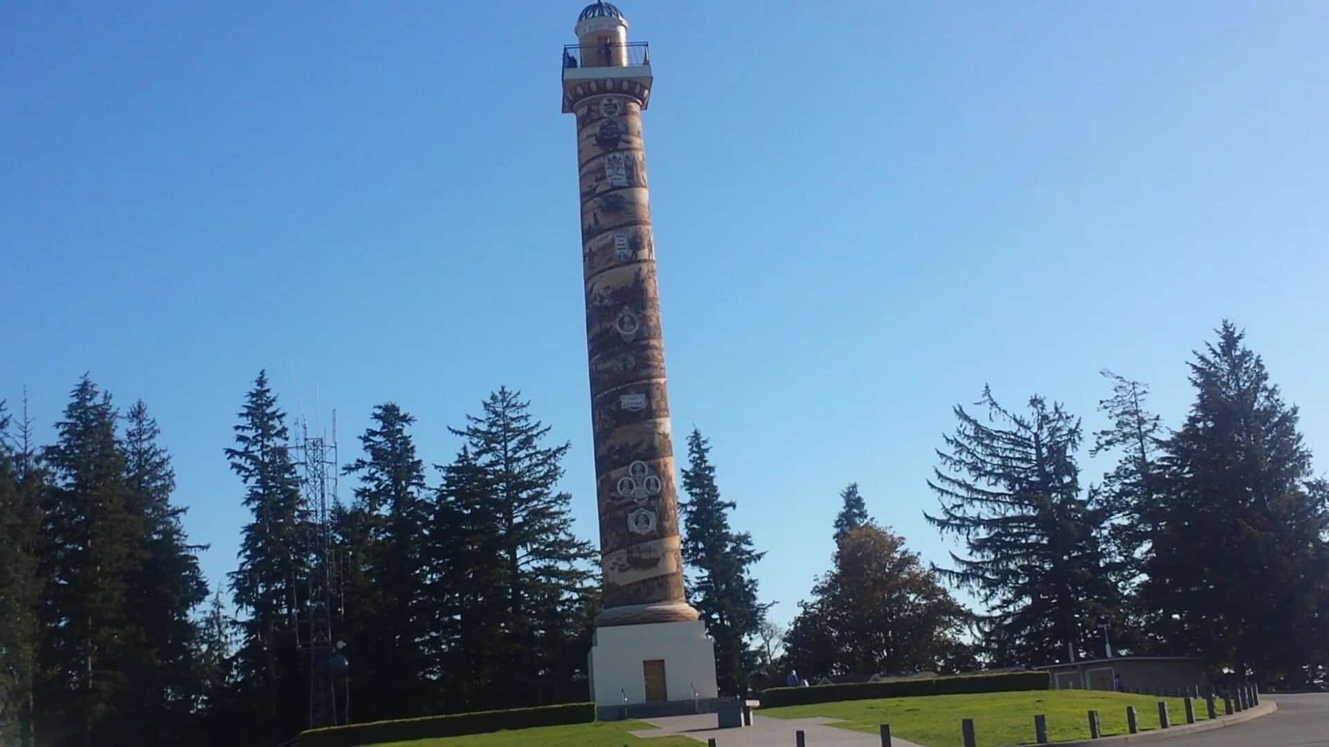 The Astoria Column rising above the forest in Astoria, Oregon
