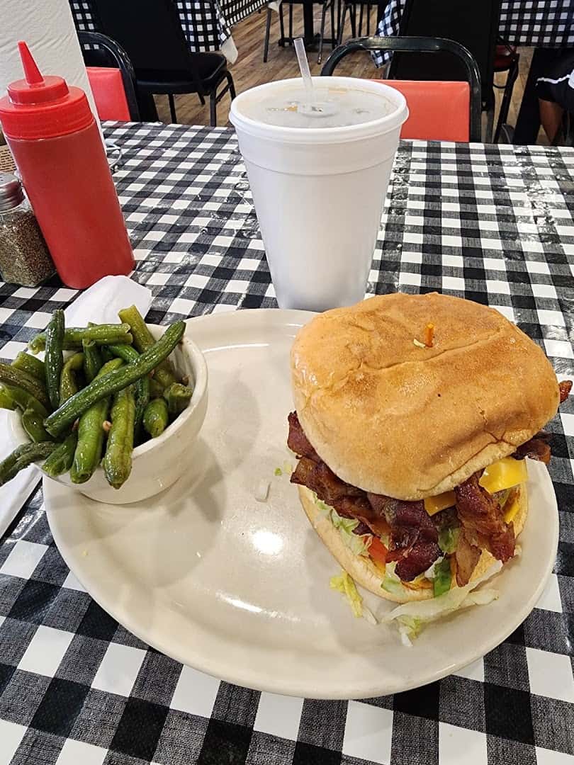 Bacon cheeseburger with green beans at Mels Country Cafe in Tomball, Texas