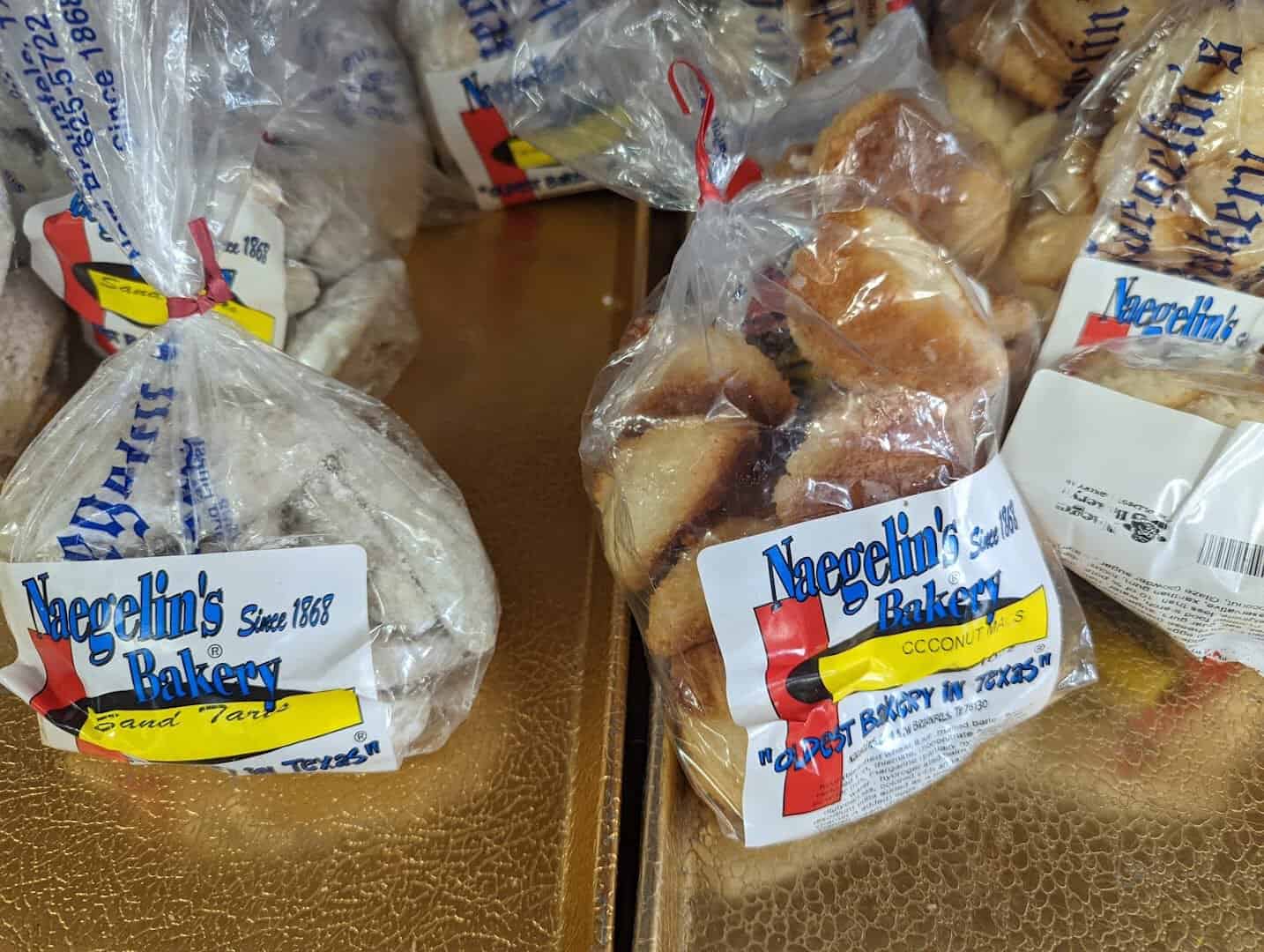 Bagged breads and sand tarts with Naegelin's Bakery labels in New Braunfels