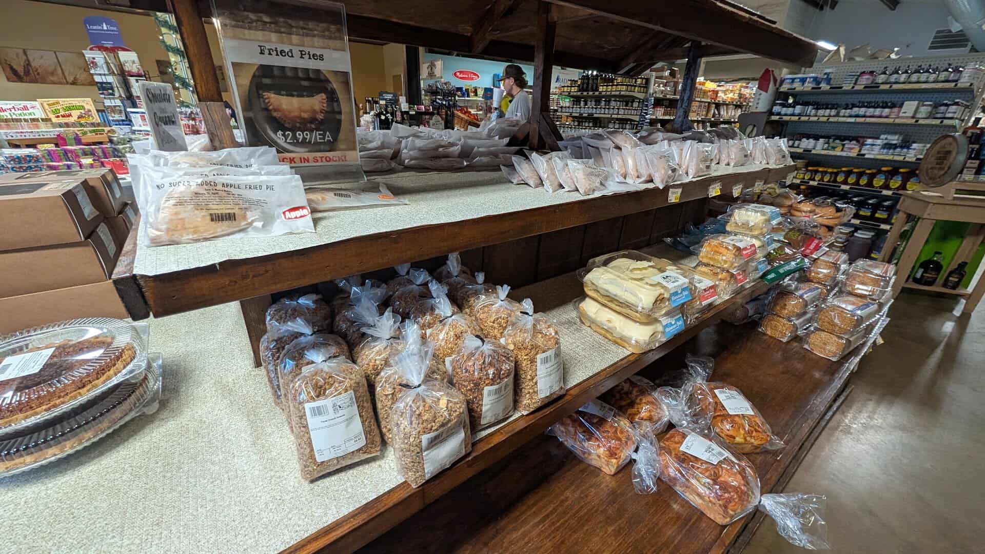 Bakery table with pies and bagged baked goods at Olde Towne Country Store in Itasca Texas
