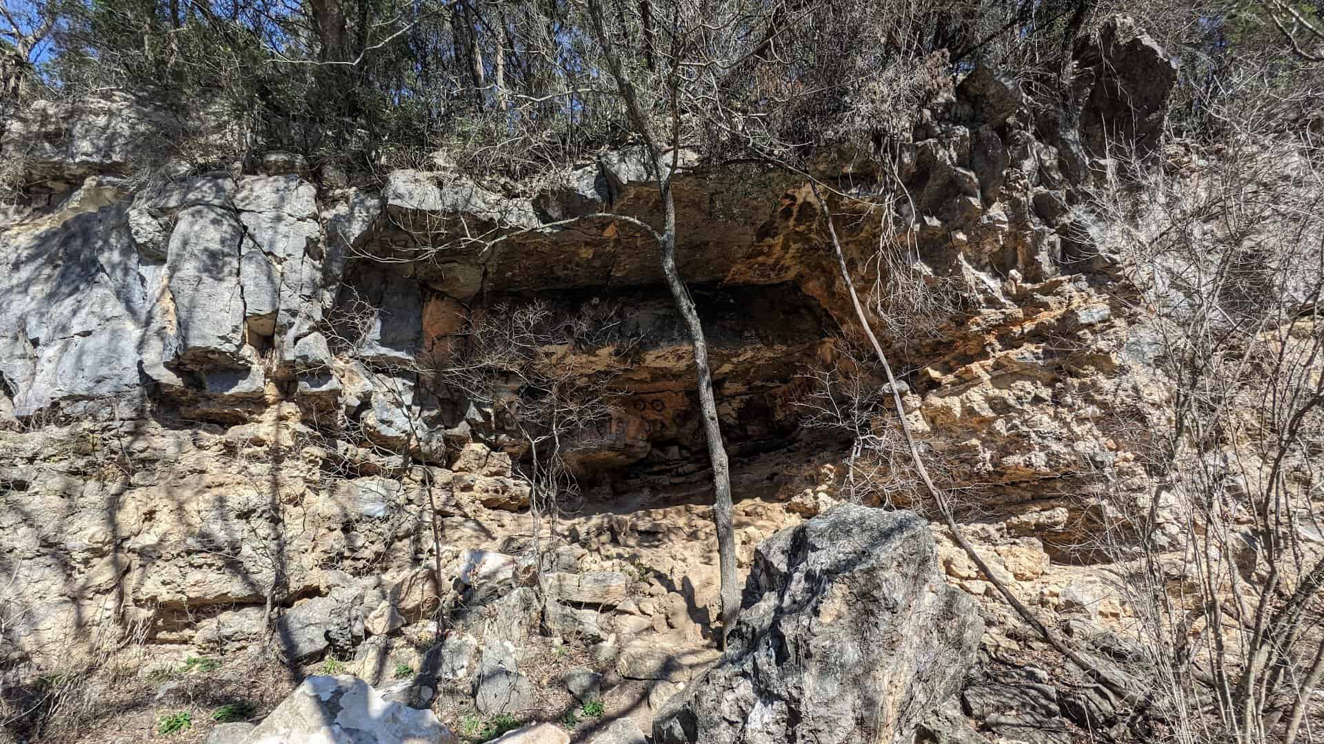 Limestone cliff and rock overhang above Barton Creek in the Austin greenbelt