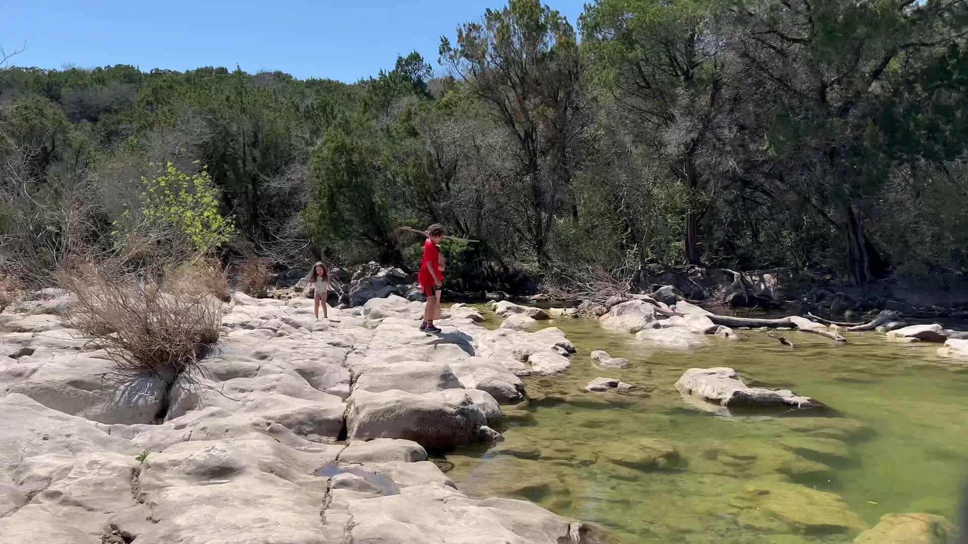 Wide limestone flats and shallow water along Barton Creek in the Austin greenbelt