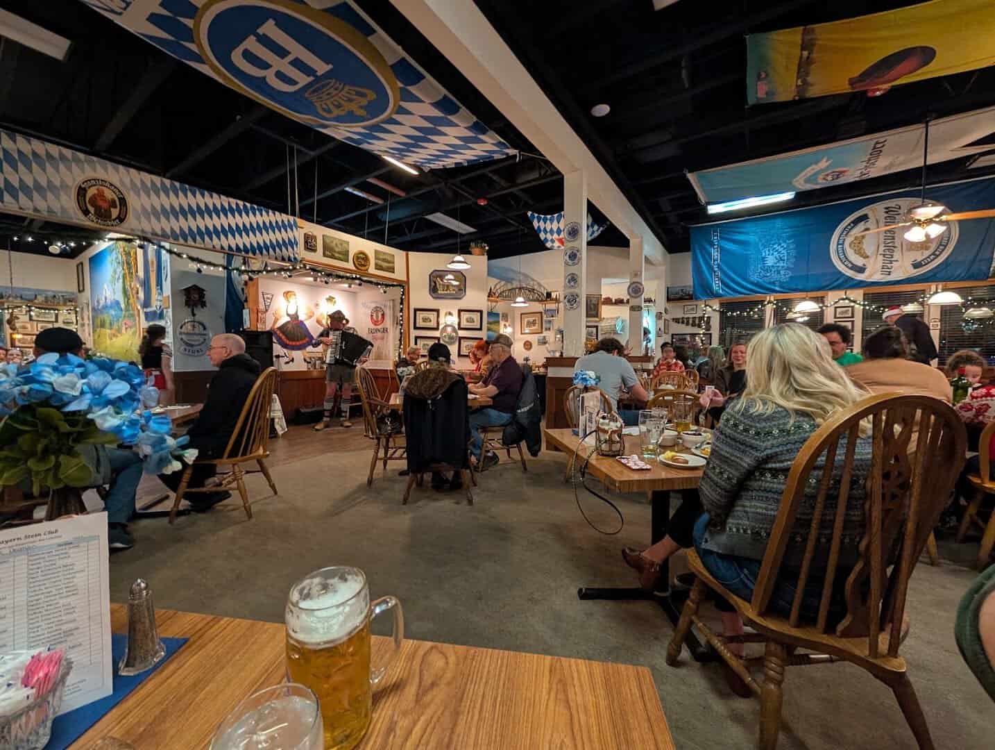 Lively dining room with long tables at Bavarian Grill in Plano, Texas